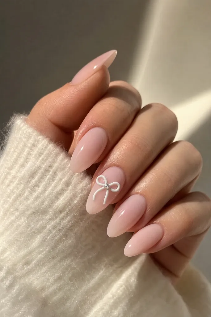 Light Summer Nails 2026 Sheer Nude Nails With Dainty Bow Accent Detail