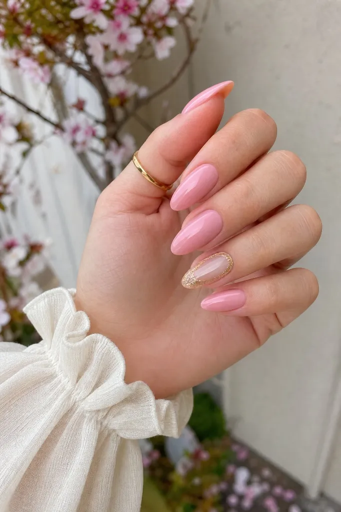 Light Summer Nails 2026 Pink Almond Nails With Gold Foil Accent and Cherry Blossom Energy