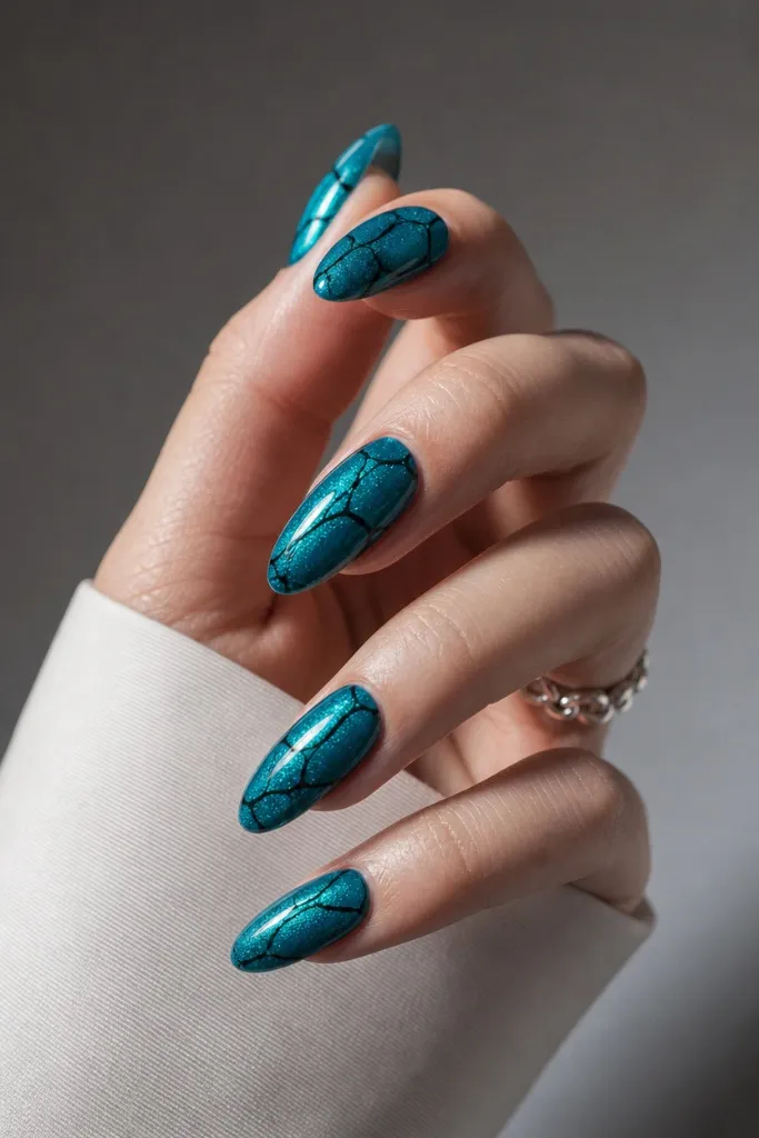 Summer Nails Inspo 2026 Teal Crackle Almond Nails That Channel Deep Ocean Energy