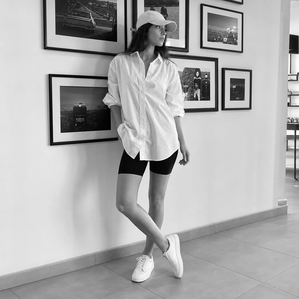 July 2026 Fashion Trends Oversized White Button-Down With Black Bike Shorts and Sporty Ease