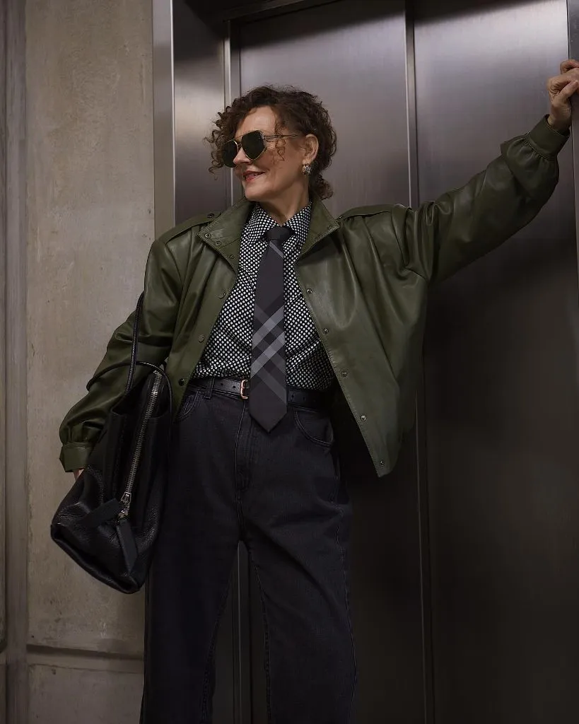 What to Wear This Fall 2026 Over 50 Olive Leather Jacket With Plaid Tie and Dark Denim
