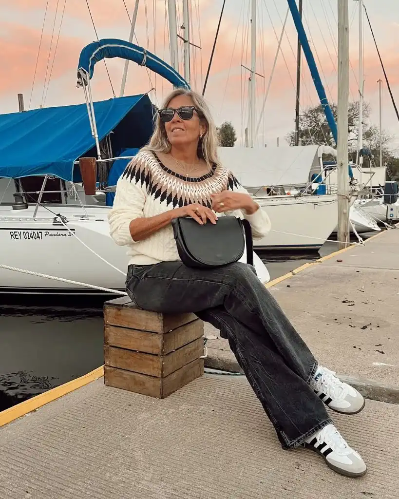 What to Wear This Fall 2026 Over 50 Fair Isle Sweater With Faded Black Jeans at the Marina
