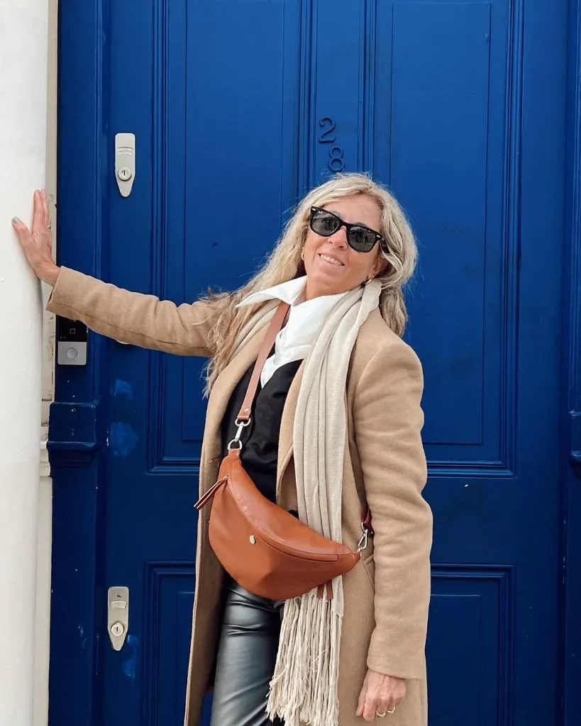 What to Wear This Fall 2026 Over 50 Camel Coat With Cognac Belt Bag and Leather Leggings
