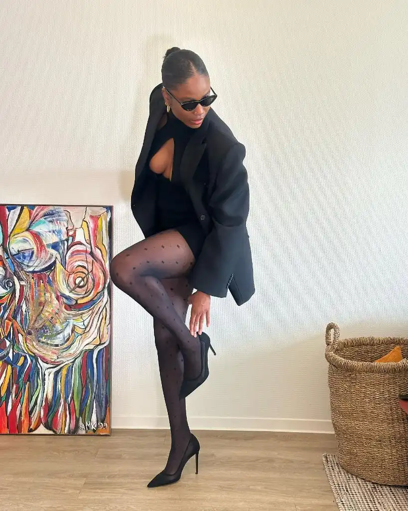 Fall Outfits for Black Women in 2026 All-Black Blazer With Polka-Dot Tights for After-Dark Dressing