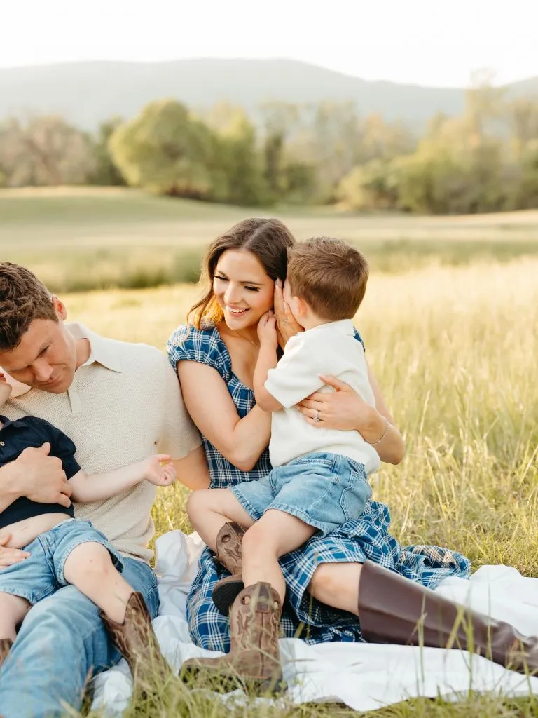 Fall Family Picture Outfits 2026 Plaid Blanket and Cowboy Boots in a Golden Meadow