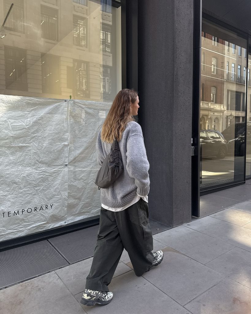 Fall Outfits with Sweater 2026 Grey Slouchy Knit With Dark Cargo Pants and Chunky Sneakers