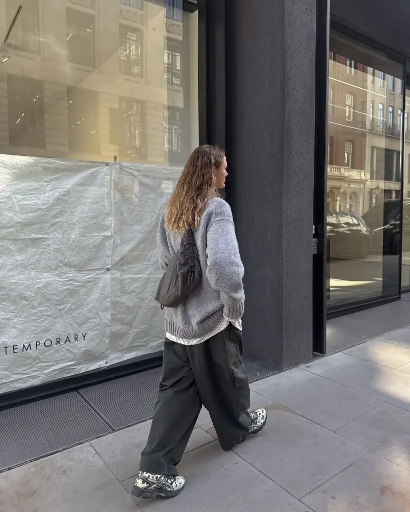 Fall Outfits with Sweater 2026 Grey Slouchy Knit With Dark Cargo Pants and Chunky Sneakers