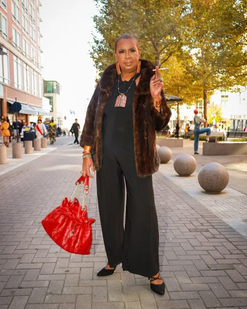 Fall Outfits for Black Women in 2026 Dark Fur Coat With Black Jumpsuit for Bold Street Style