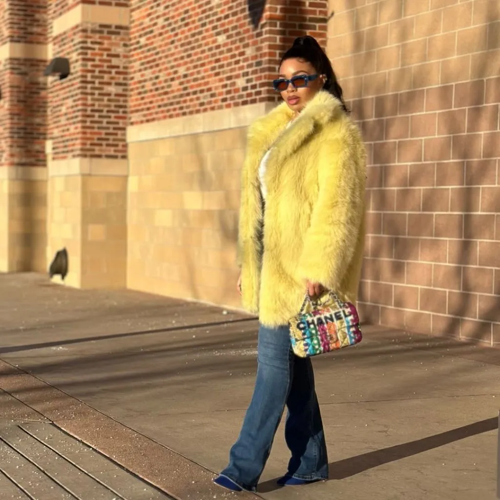 Fall Outfits for Black Women in 2026 Yellow Faux Fur Coat With Wide-Leg Jeans for Statement Dressing