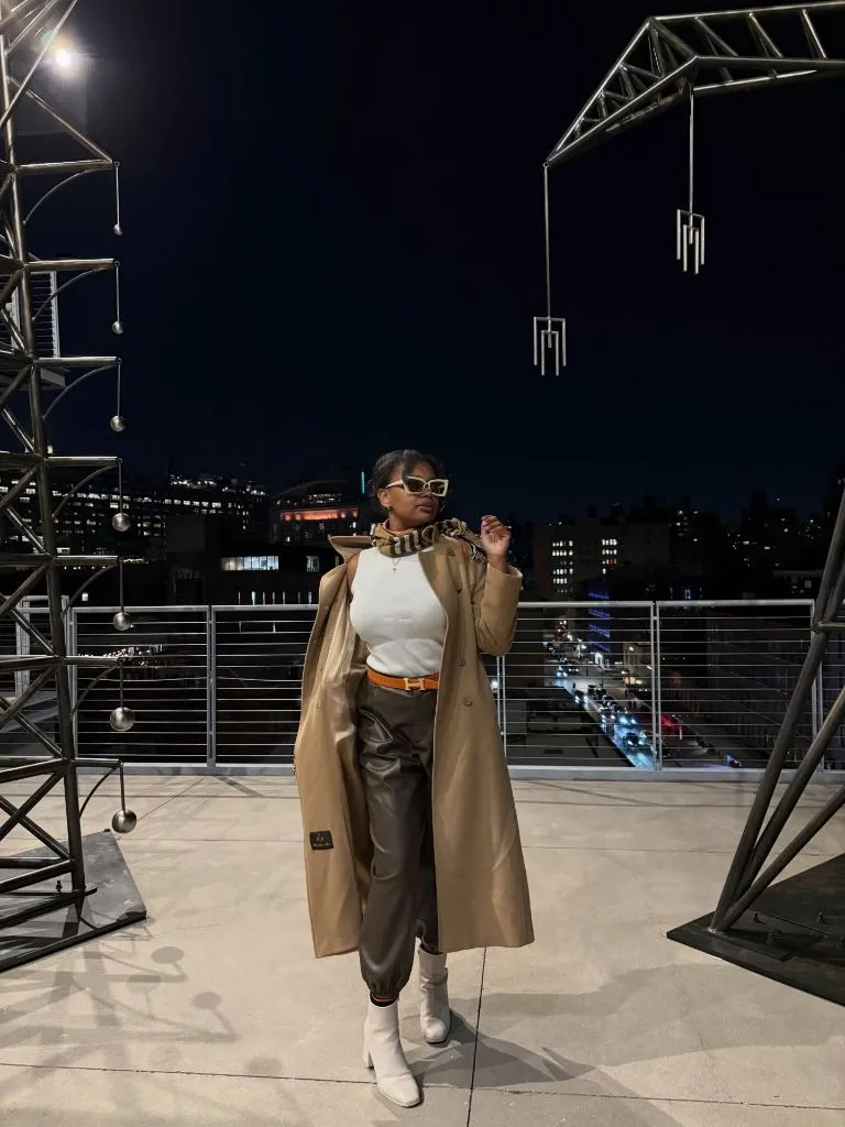 Fall Outfits for Black Women in 2026 Camel Trench With Leather Trousers for a Rooftop Evening