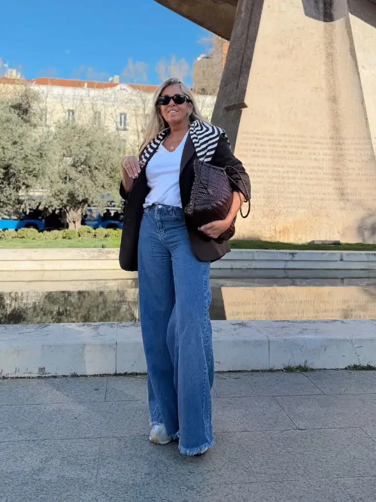 What to Wear This Fall 2026 Over 50 Black Blazer With Chevron Striped Sweater and Wide Jeans