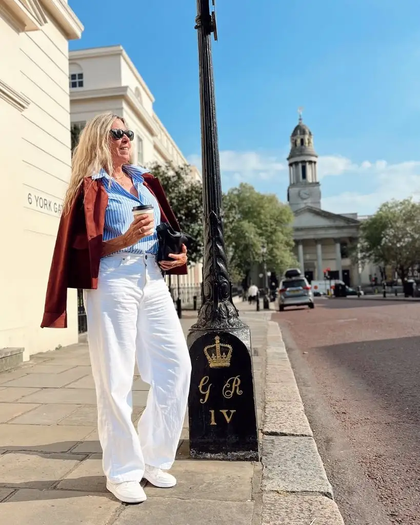 What to Wear This Fall 2026 Over 50 Blue Striped Shirt With Burgundy Jacket and White Trousers