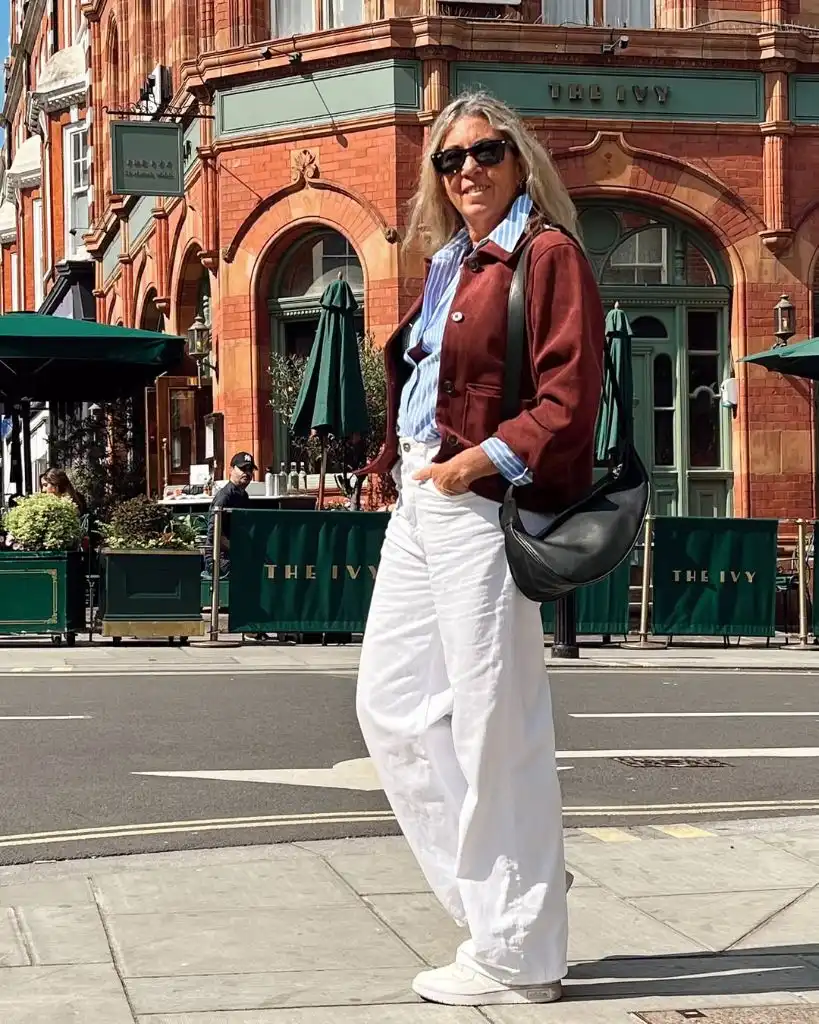 What to Wear This Fall 2026 Over 50 Burgundy Cropped Jacket With Striped Shirt and White Pants