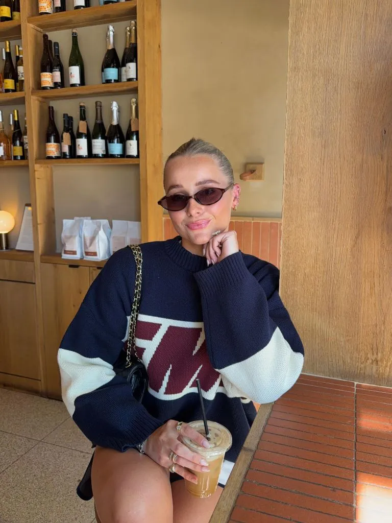 Fall Outfits with Sweater 2026 Navy Graphic Knit With Iced Coffee Energy