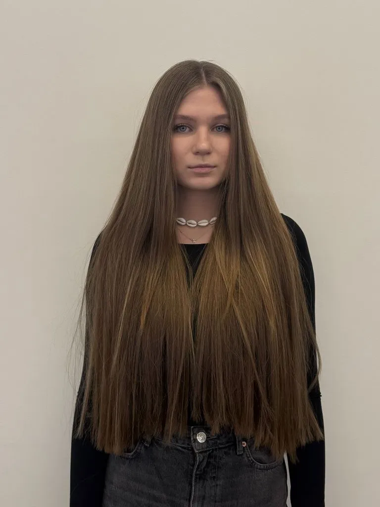 Fall Haircuts for Women 2026 Long Natural Brunette With A Blunt Center Part