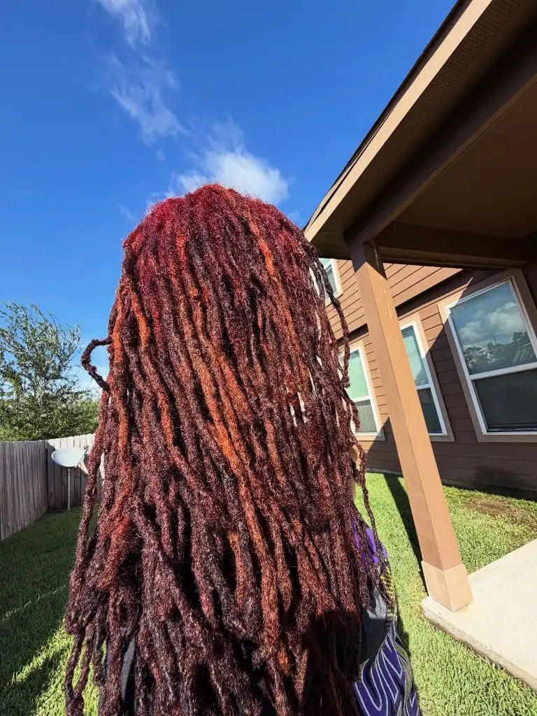 Locs Hairstyles for Black Women 2026 Fiery Red-Orange Locs with Bold All-Over Color