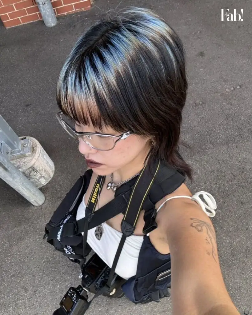 August Hairstyles And Color Ideas 2026 Inky Black Base With Electric Blue Streaks For A Punk Shag