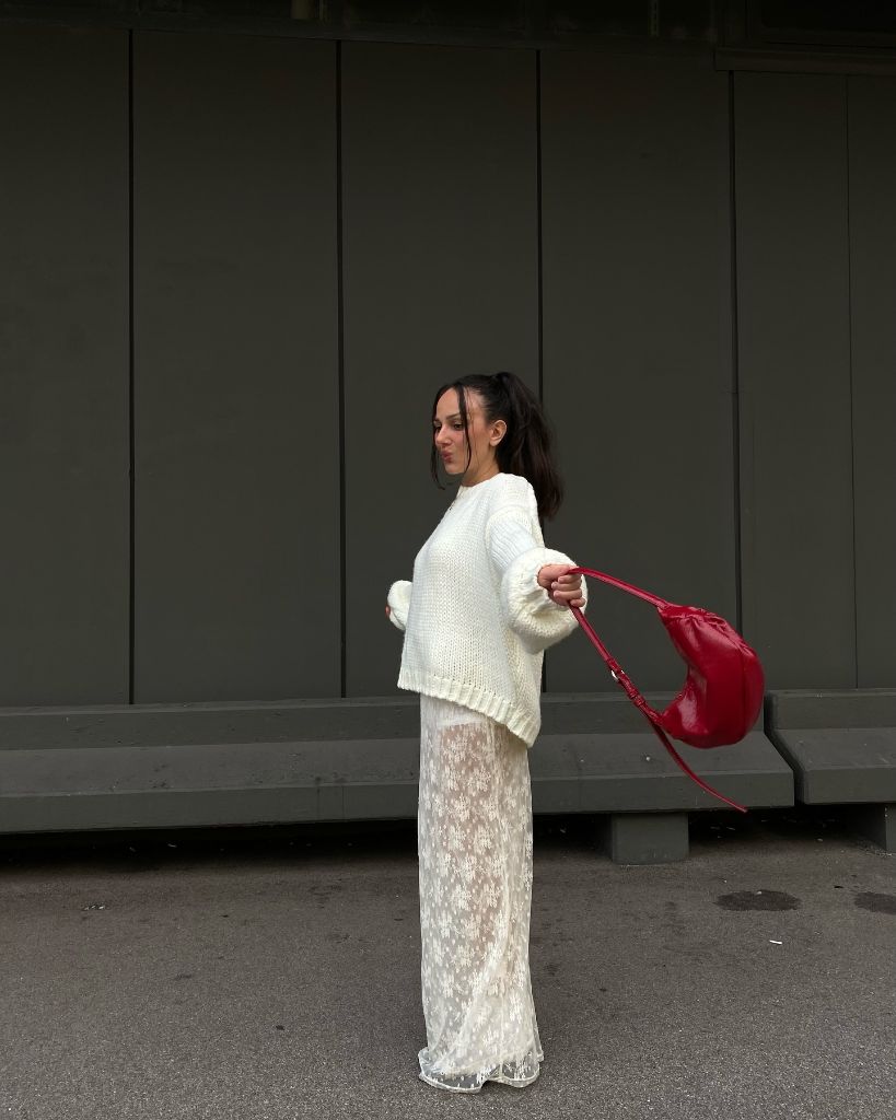 Early Fall Outfits 2026 White Chunky Knit With Sheer Lace Pants and Red Bag