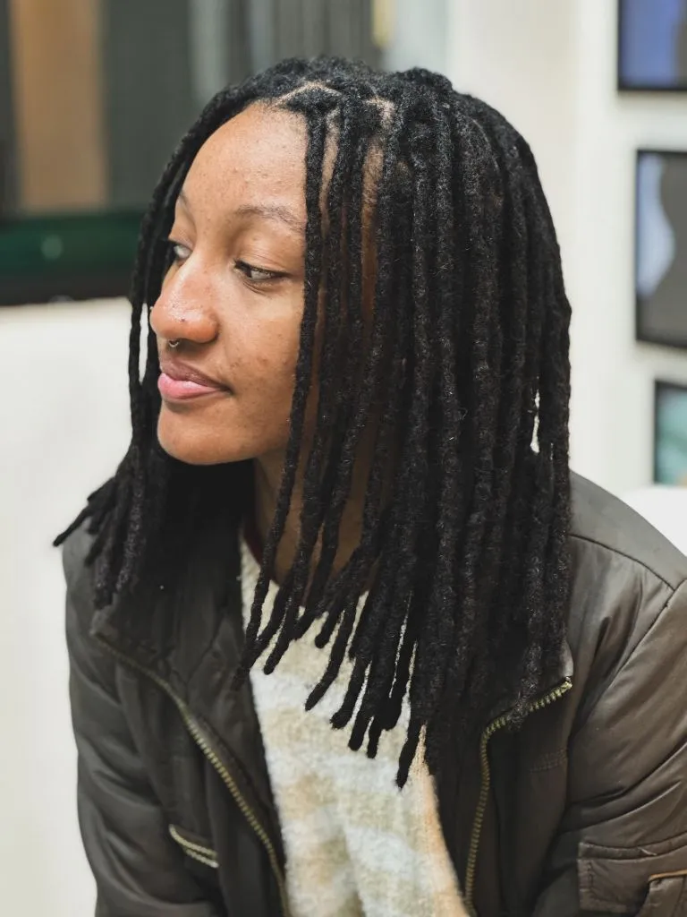 Locs Hairstyles for Black Women 2026 Sleek Natural Locs with Soft Center Part and Clean Lines
