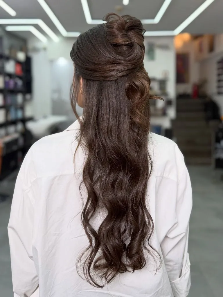 Fall Hairstyles for Wedding Guests 2026 Chocolate Half-Up Bun with Long Flowing Waves