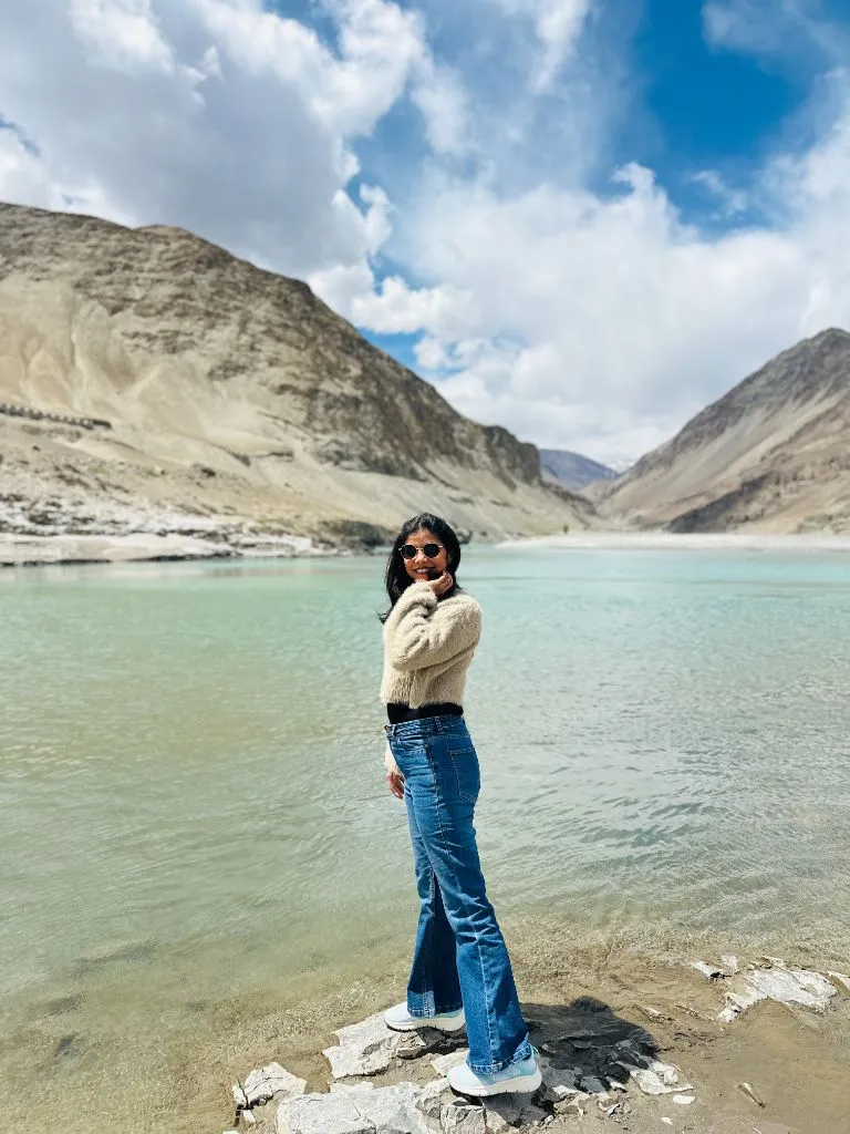 Fall Travel Outfits 2026 Fuzzy Cream Sweater With Flare Jeans For Mountain Lake Views
