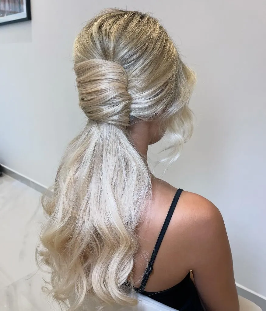 Fall Hairstyles for Office 2026 Wrapped Low Ponytail with Platinum Volume and Soft Curls