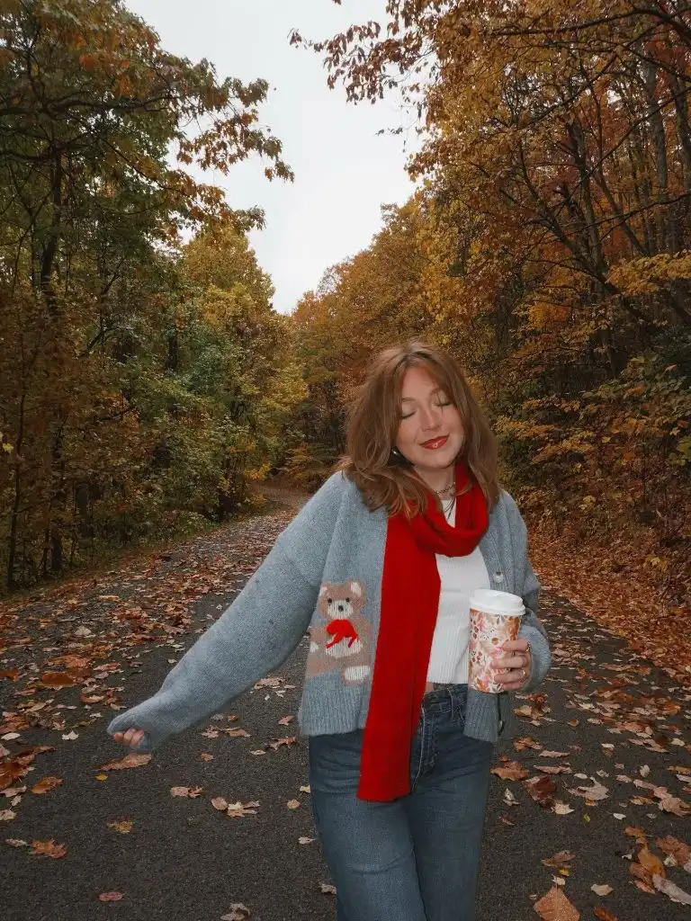 Fall Mom Outfits 2026 Bear Cardigan And Red Scarf On A Fall Path