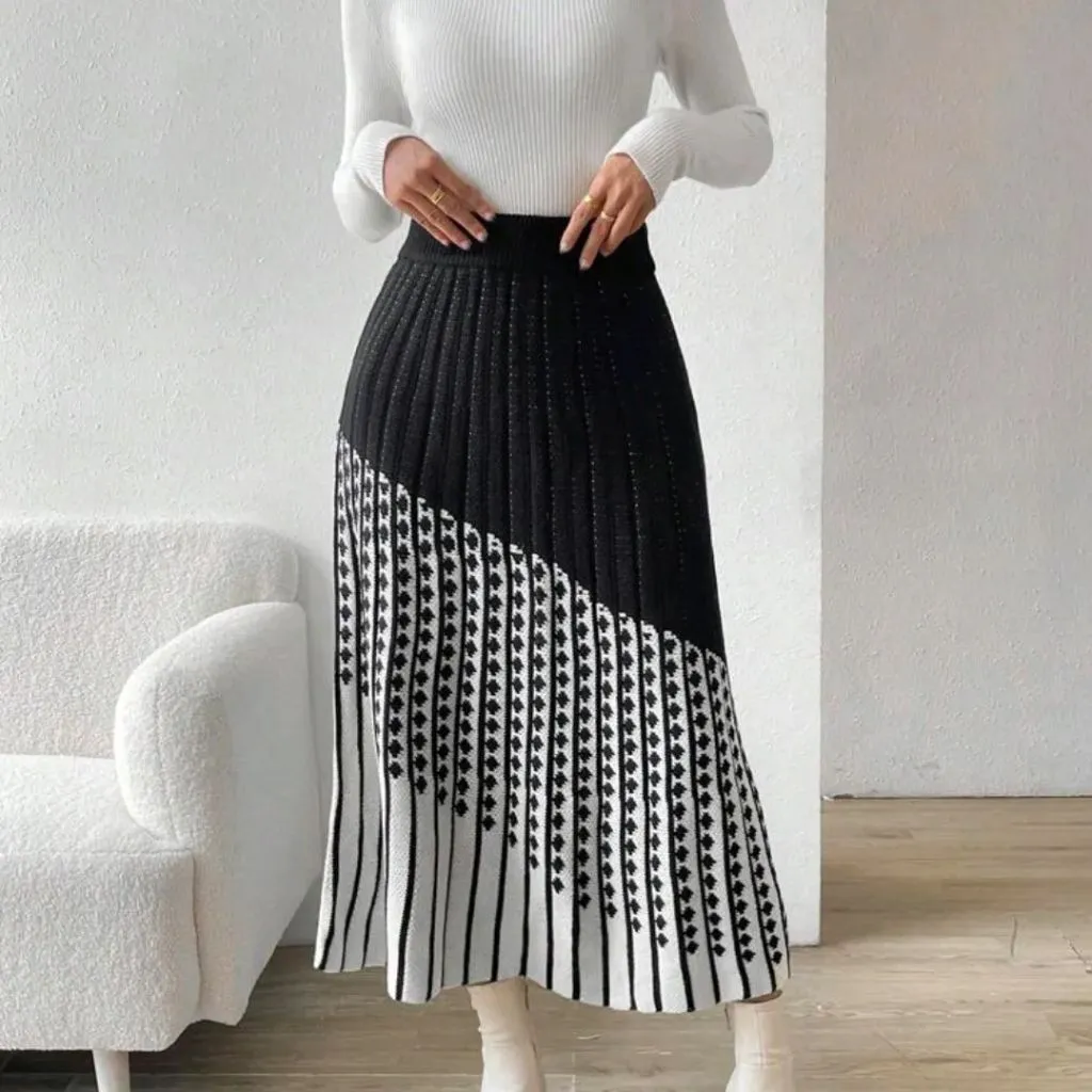 Knit Skirt Outfits Fall 2026 Black-and-White Pleated Knit Midi With a White Sweater for Graphic Elegance