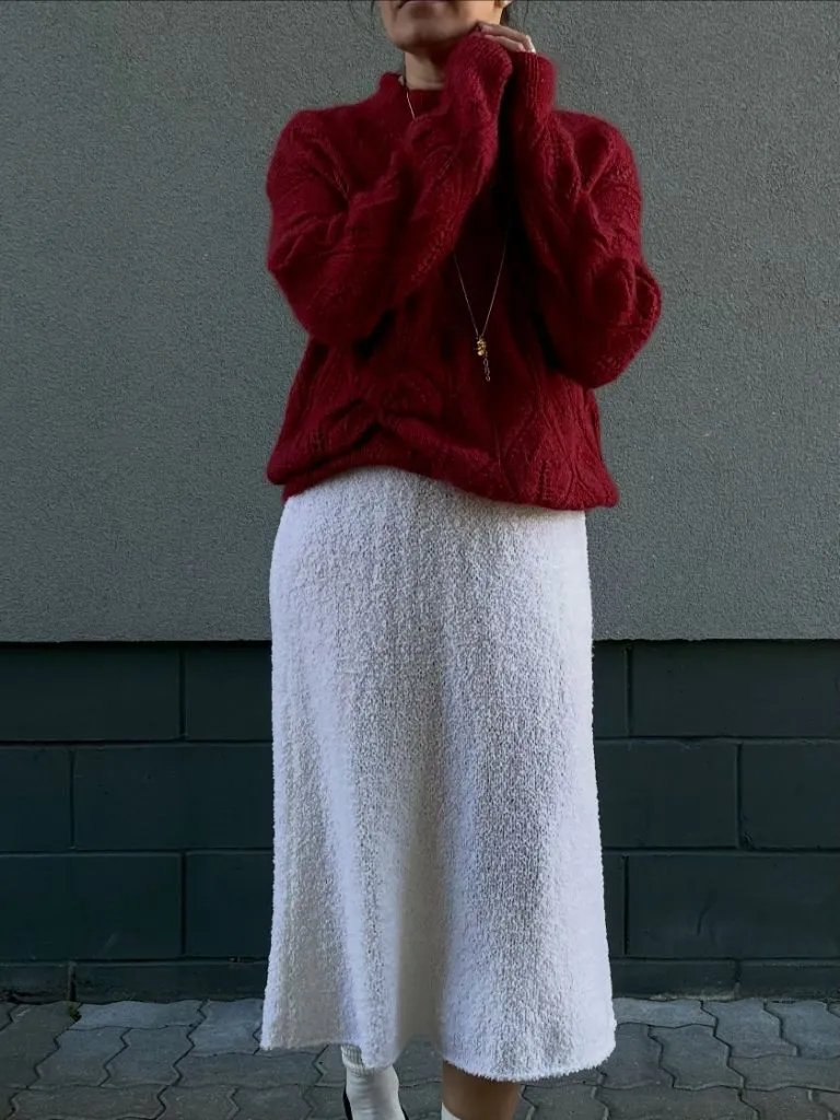 Knit Skirt Outfits Fall 2026 White Boucle Midi With a Red Cable-Knit Sweater for Bold Color Contrast