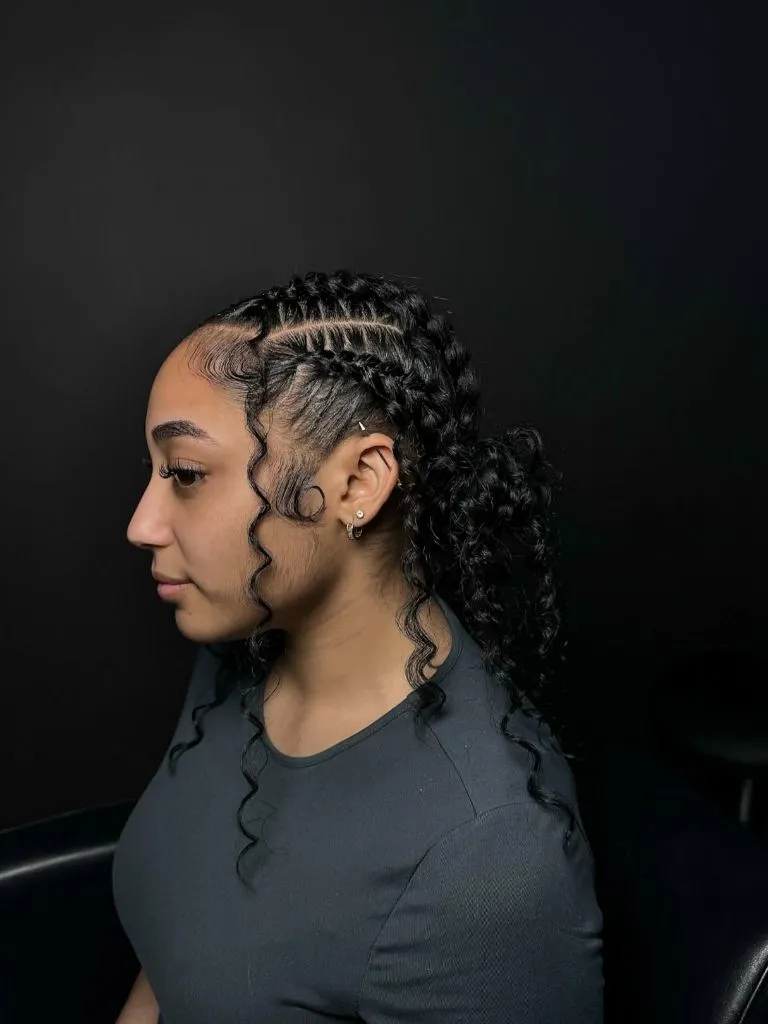 Butterfly Braids Hairstyle 2026 Sleek Feed-In Braids Gathered into a Curly Low Ponytail