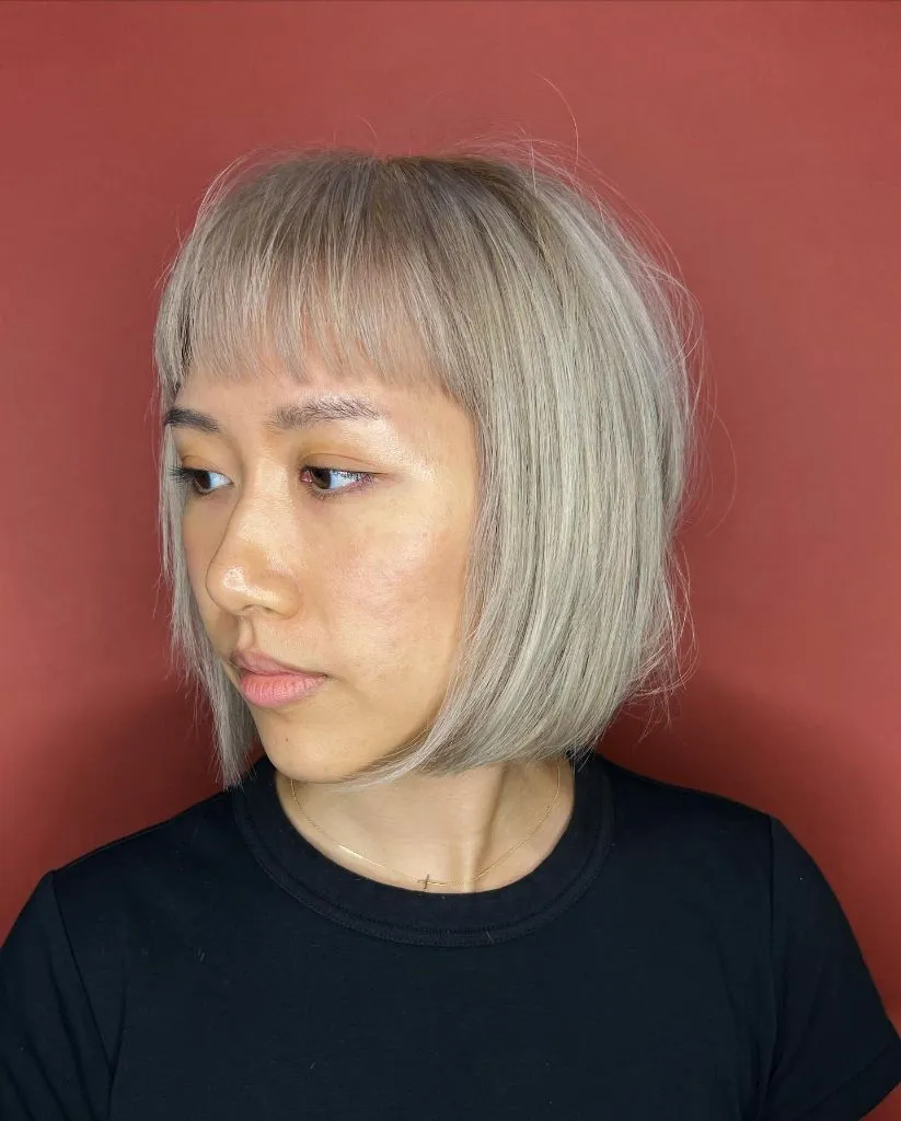 Bobbed Haircut for Women 2026 Ash Blonde Bob with Wispy Bangs and Lived-In Texture