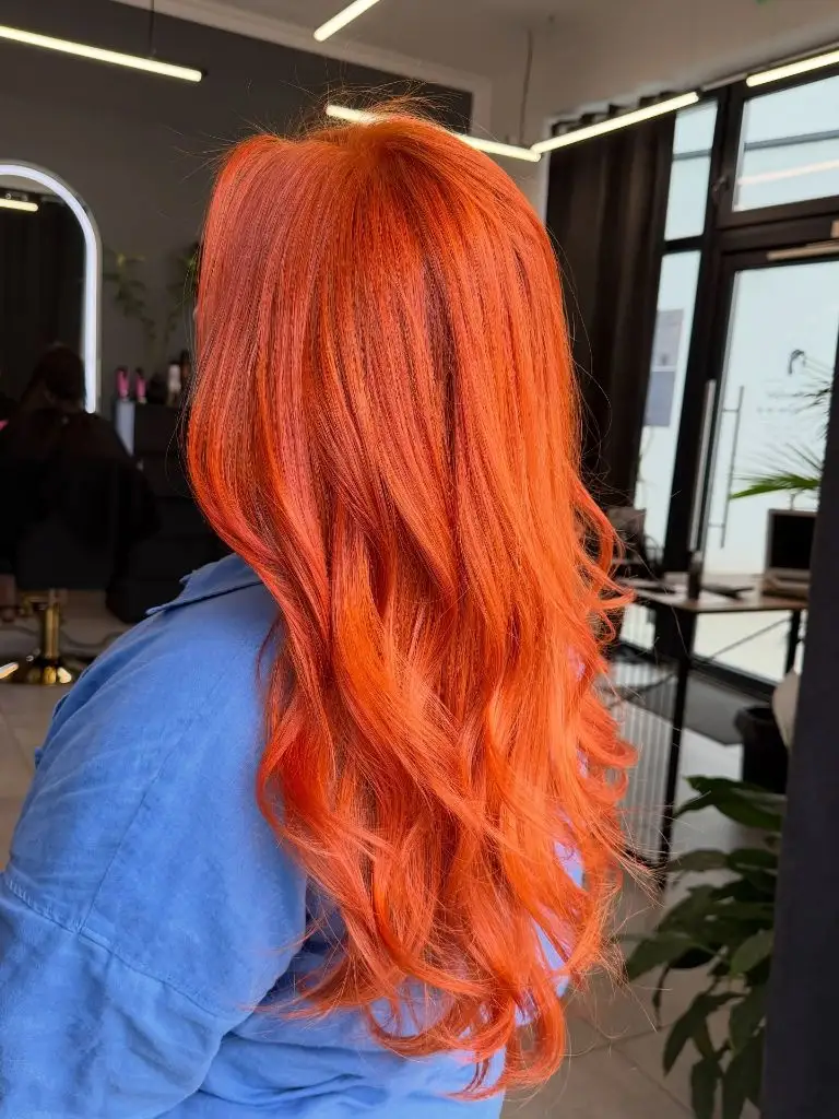 Fall Hair Colour Ideas 2026 Vivid Copper Orange with Flowing Waves for a Bold Autumn Statement