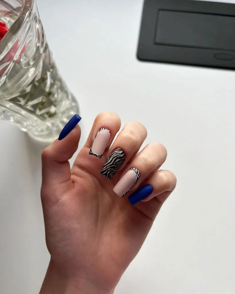 August Nails Ideas 2026 Matte Blue and Zebra-Print Square Nails for a Contemporary Finish