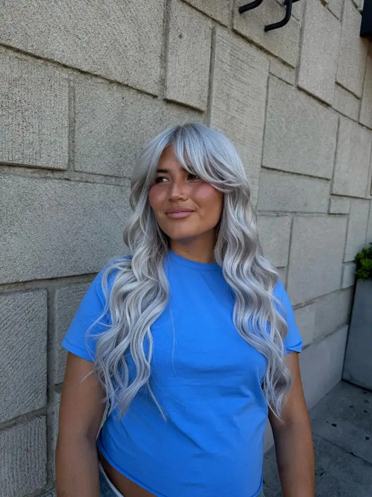 Fall Hairstyles 2026 Icy Silver Waves with Curtain Bangs for a Bold Cool-Toned Look