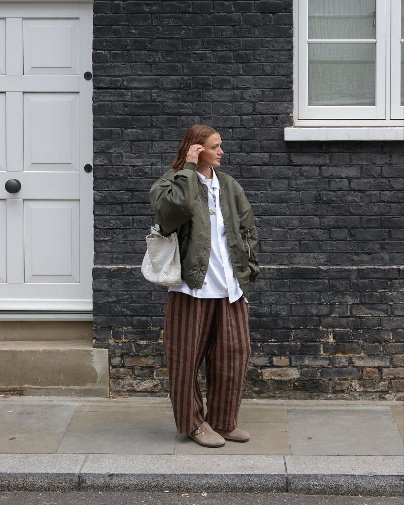 What Are the Best Fall Outfits for Casual Days 2026 Green Bomber Over Striped Wide Trousers