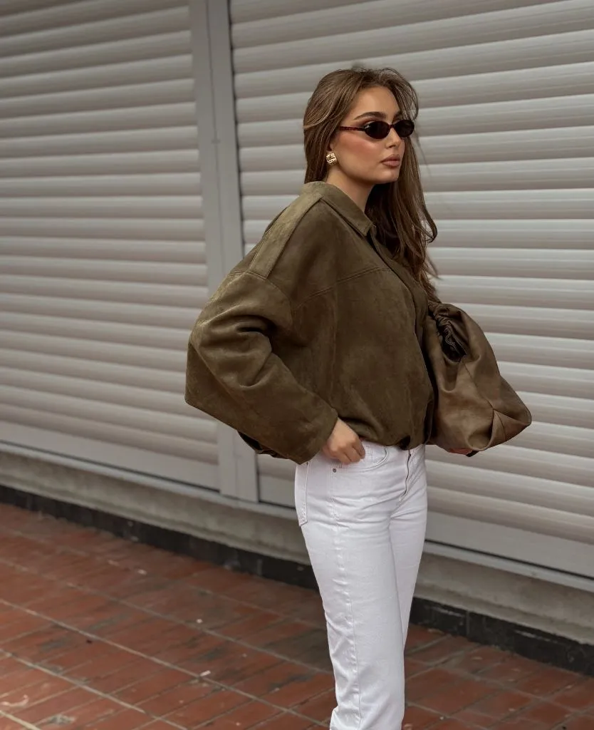 Early Fall Outfits 2026 Olive Suede Bomber With White Jeans for Transitional Warmth