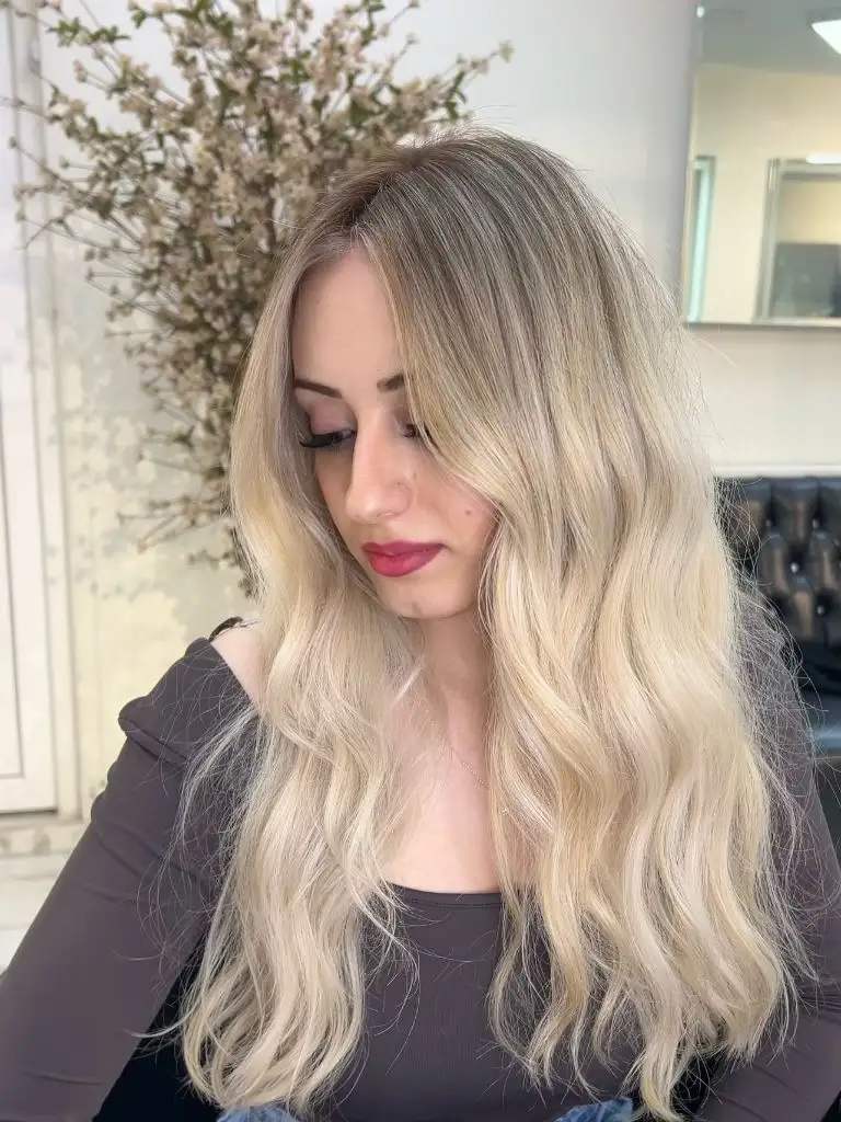 Fall Blonde Hair Colour 2026 Soft Champagne Blonde with Romantic Waves and Rooted Dimension