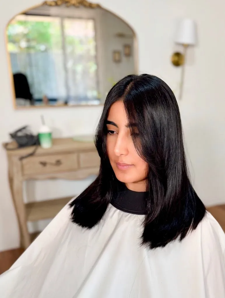 Fall Haircuts for Women 2026 Jet Black Lob With Invisible Layers And A Deep Part