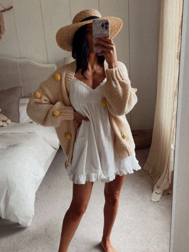 Fall Sweater Dress Outfits 2026 Lemon-Embroidered Cardigan Over a White Mini Dress for Late Summer Crossover
