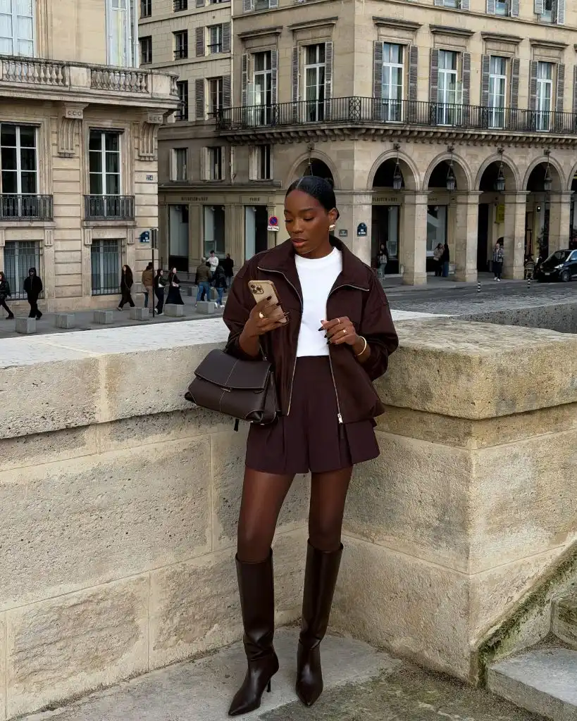 Nice Fall Outfits 2026 Chocolate Bomber and Pleated Shorts With Knee-High Boots