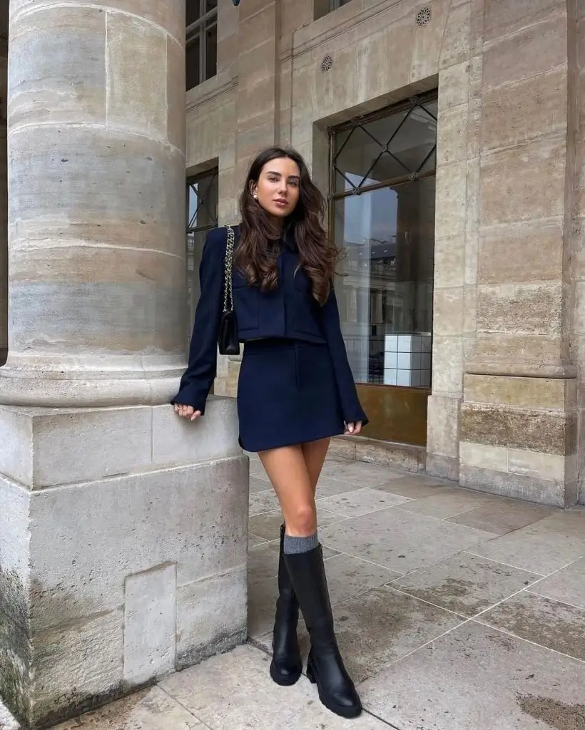 Nice Fall Outfits 2026 Navy Cropped Jacket and Mini Skirt With Tall Boots for Polished Days