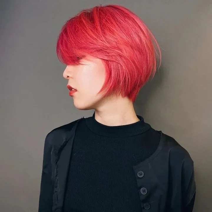 Bobbed Haircut for Women 2026 Fiery Coral Layered Bob with Textured Fringe