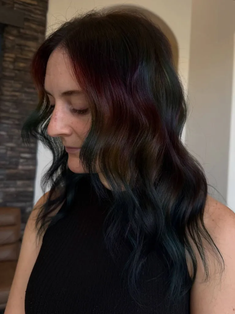 August Hairstyles And Color Ideas 2026 Oil-Slick Brunette With Hidden Jewel Tones For A Subtle Twist