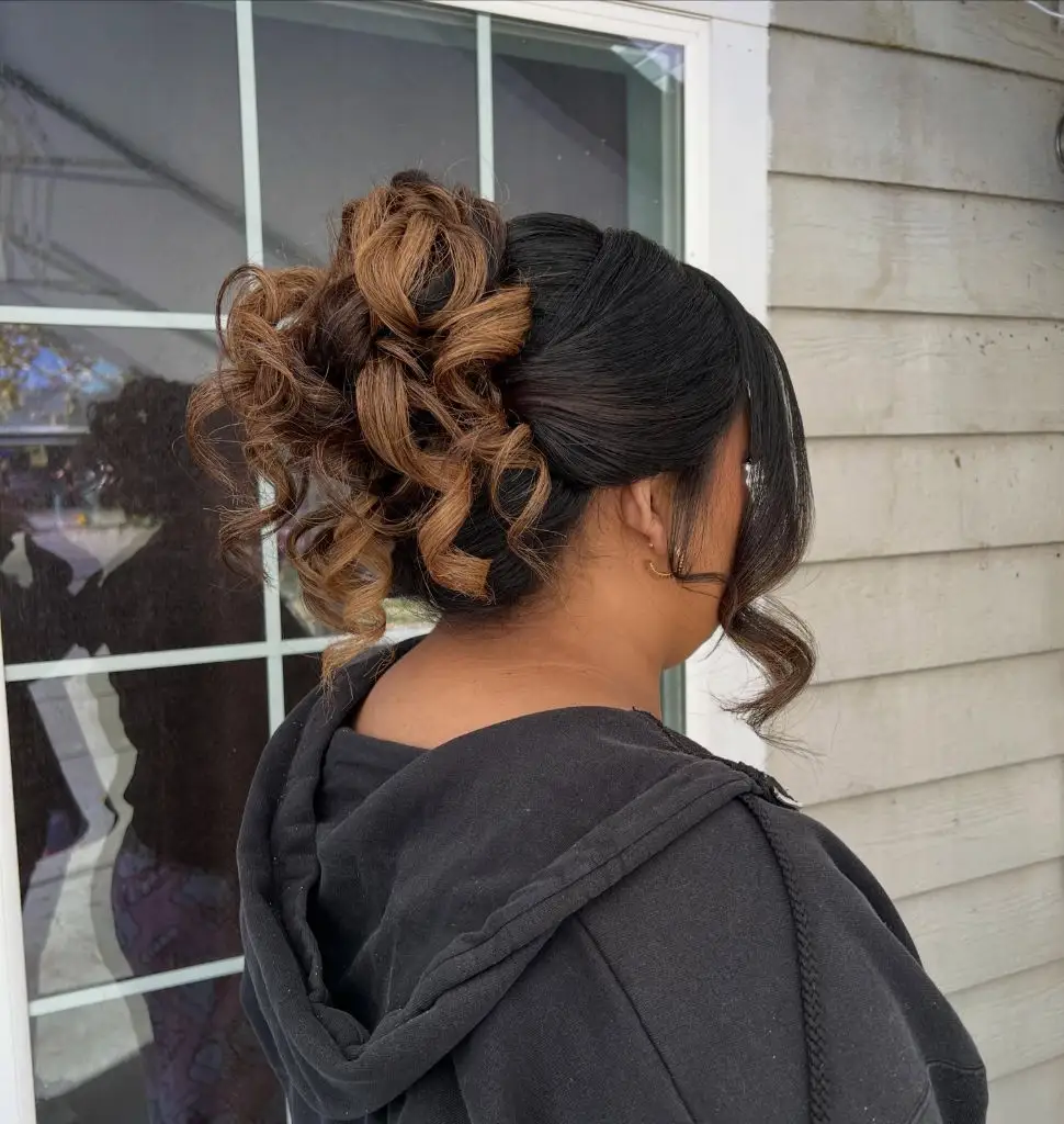 Fall Hairstyles for Wedding Guests 2026 Dramatic Curly High Updo with Sleek Sculpted Sides