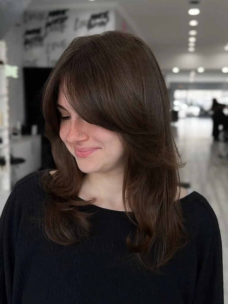 Fall Haircuts for Women 2026 Rich Chocolate Curtain Bangs With Soft Flipped Layers