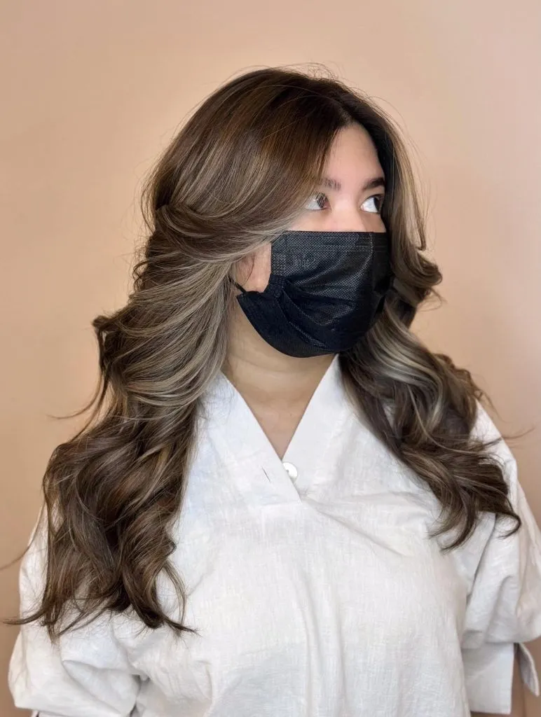 Fall Haircuts for Women 2026 Soft Mushroom Brown Waves With A Swept Side Part