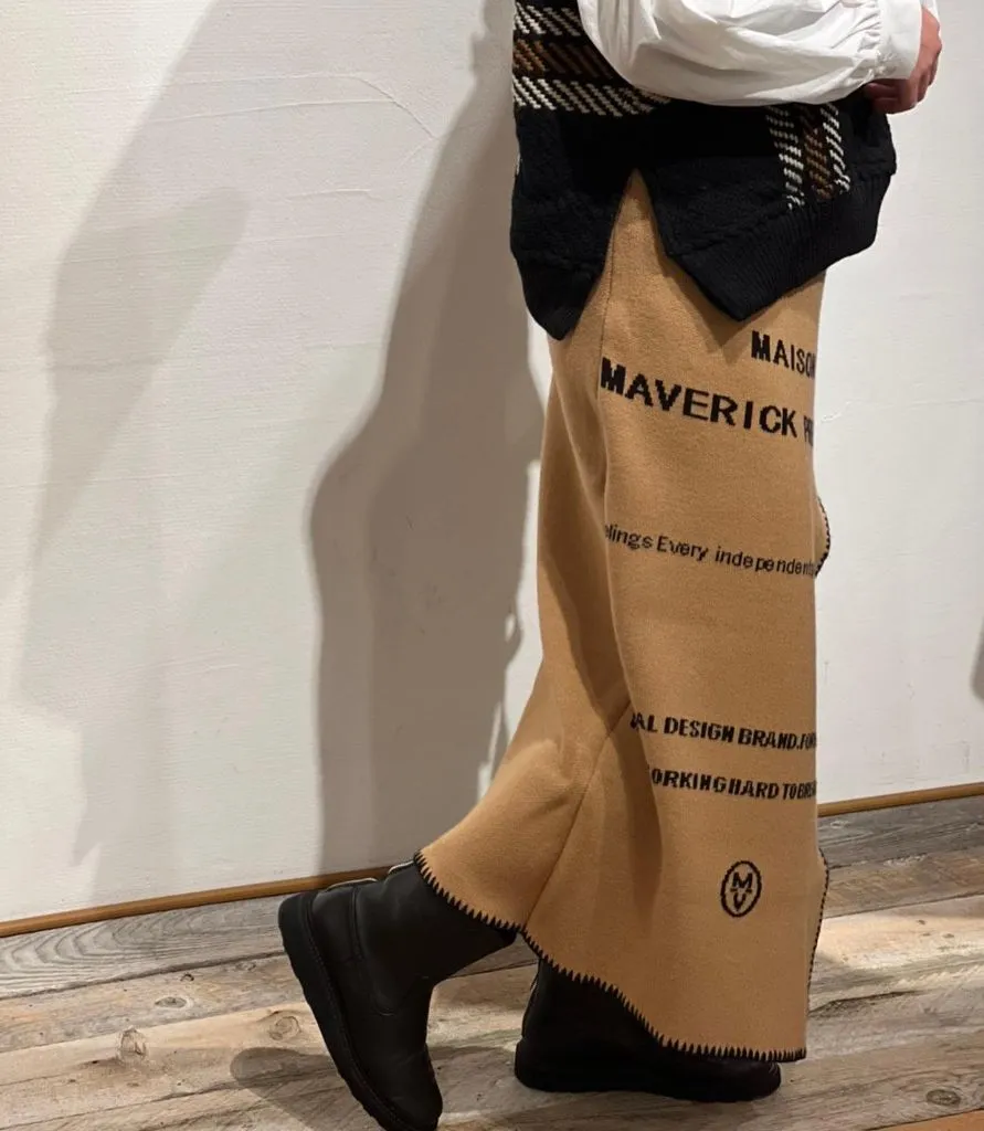 Knit Skirt Outfits Fall 2026 Tan Graphic Knit Wide-Leg Pants With a Plaid Vest for Streetwear Edge
