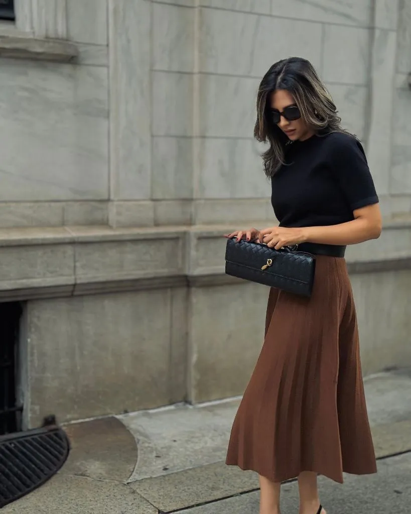 Knit Skirt Outfits Fall 2026 Brown Pleated Knit Midi With a Black Knit Top for Polished Mornings