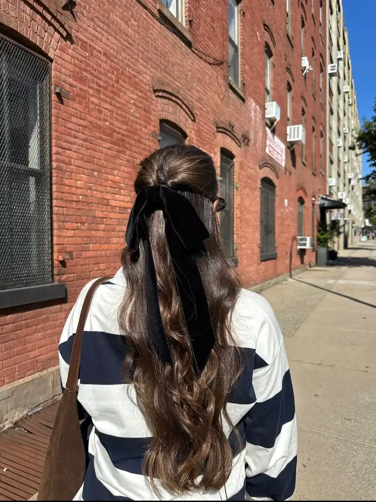 Fall Hairstyles 2026 Half-Up Wavy Brunette with Velvet Bow for a Romantic Fall Moment