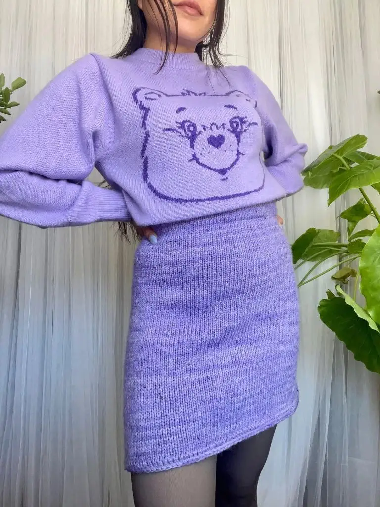 Knit Skirt Outfits Fall 2026 Lilac Knit Mini Skirt With a Graphic Sweater for Playful Days